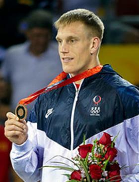 Adam Wheeler accepts his gold medal in Beijing