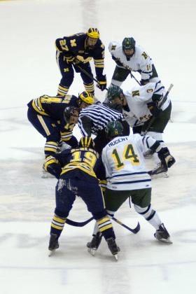 The two teams faceoff at center ice.