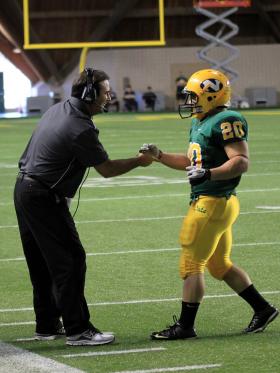 Chris Ostrowsky has been named NMU football coach.