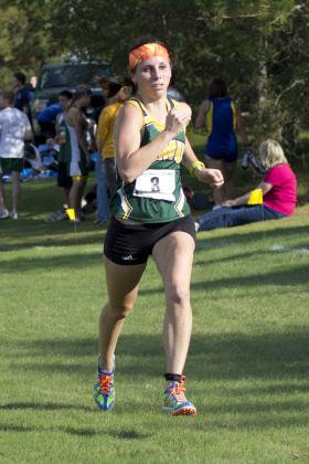 Junior Rita Woitas at the finish line.