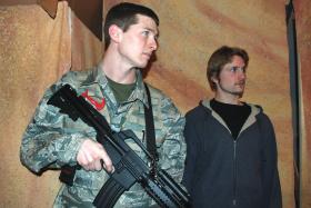 NMU alumnus Brenton Fitzpatrick (Marine) and NMU student Maxwell Peterson (Journalist) rehearse a scene from 