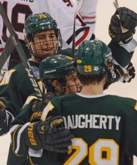 Jones, Daugherty and Nowick celebrate.