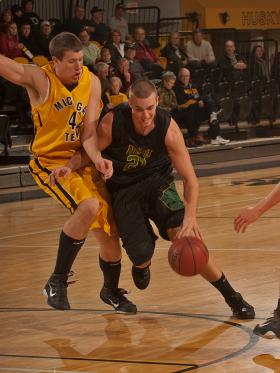 Matthew Craggs drives to the hoop,