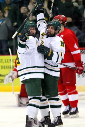 Nugent and Gron celebrate an NMU goal.