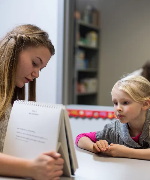 Student working with a child in the speech, language and hearing sciences clinic