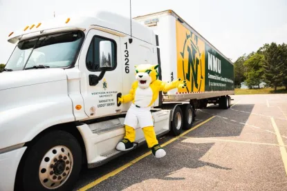 Wildcat Willy hangs out of commercial semi-truck