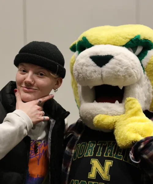A student and Wildcat Willy