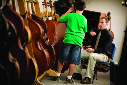 Music teacher with young student