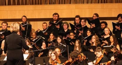 Orchestra and choir ensemble performing at Reynolds Recital Hall