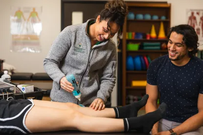 Female student working in a hands-on athletic training laboratory