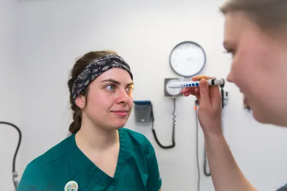 Nursing students doing an eye examination