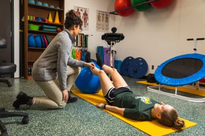 student going through physical therapy on campus