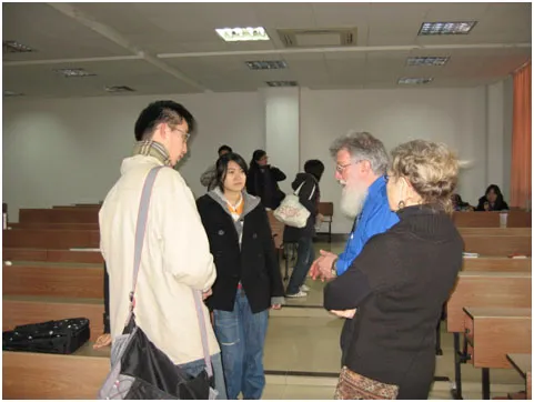 Dr Hutchison and wife Barbara had opportunities to meet with students informally also. Here they talk with ECUPL English students after class.