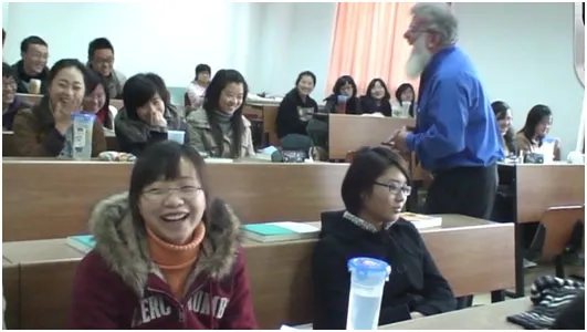 Dr. Hutchison and Chinese students share a humorous moment during his first lecture.