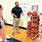 Tinti talks with girls basketball team members (Terri Castelaz/Daily News photo)