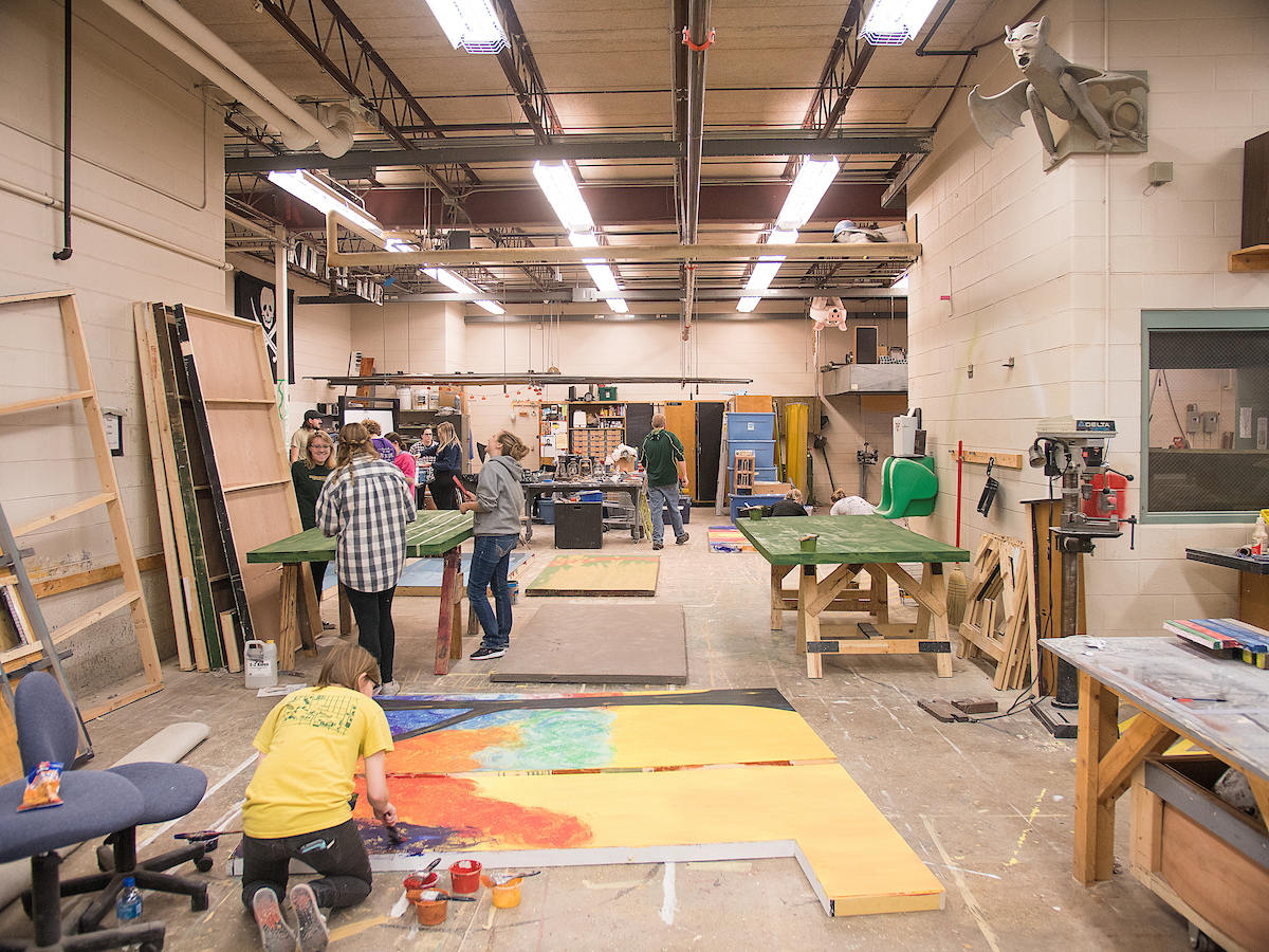 Students painting a backdrop