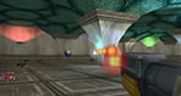 Screen shot from the GEAR UP game, showing the interior of the Static Light Room (from the original TechDemo game from Conitec Systems) with a few rovers from the Evolutionary Robotics course, a couple of particles from the intelligent particle swarm work with Cory Perry, and a weapon (rocket launcher) taken from the Shooting Range room, thus illustrating how we modified the game in the GEARUP workshop, since normally the player cannot take the weapons out of the Shooting Range room.  The screen shot also shows the explosion just after firing the rocket launcher at a support column in the Static Light Room.