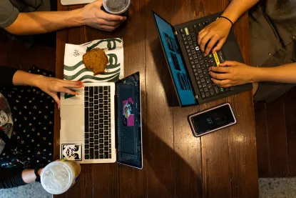 Students working on laptops in Starbucks