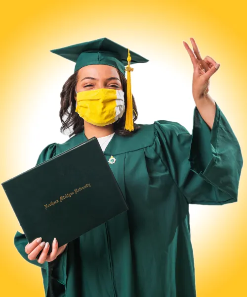 NMU graduate with a mask on