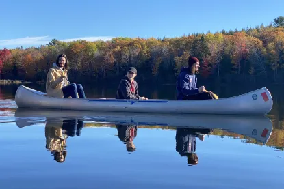 Students on a kayak on Harlow Lake.