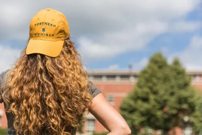 Student in NMU hat
