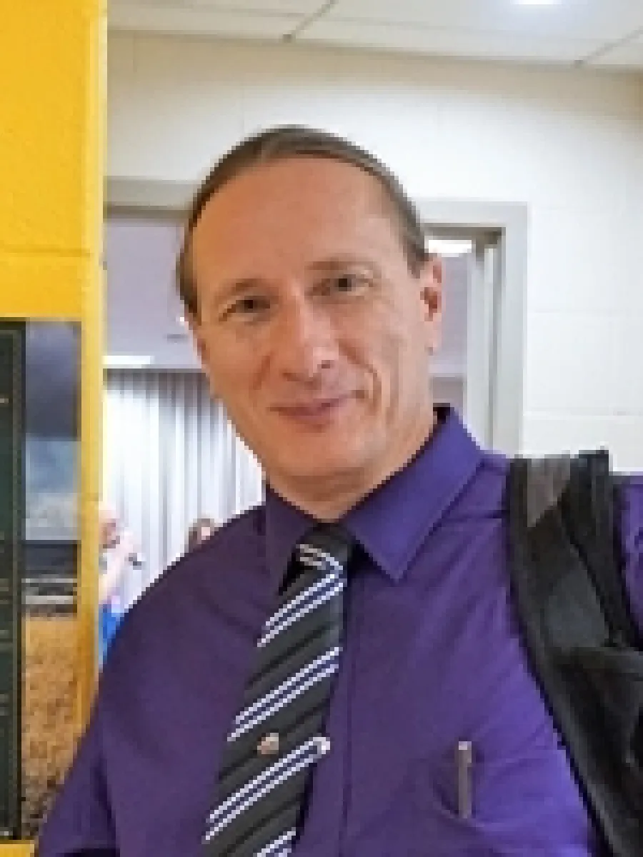 Man in purple shirt