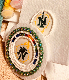 Beaded NMU logo