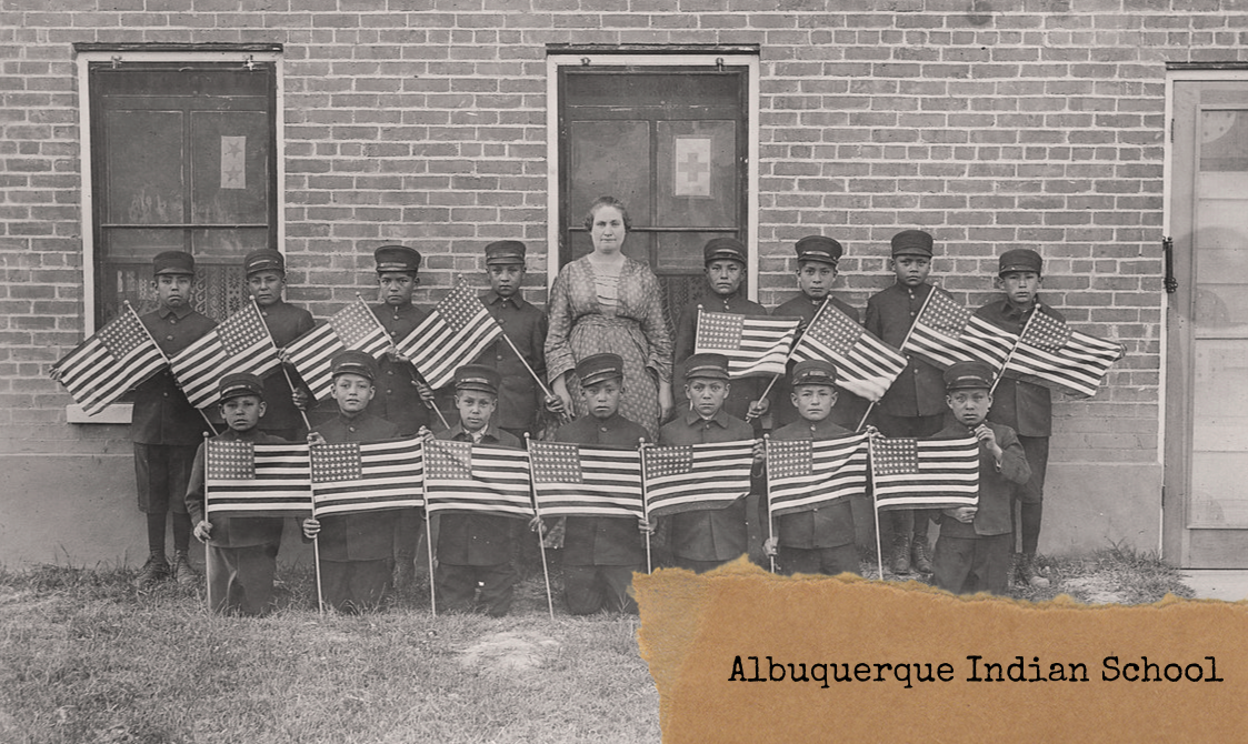 Department of the Interior. Bureau of Indian Affairs. Albuquerque Indian School. (1947 - ca. 1964) Title Very early class of young boys with flags at the Albuquerque Indian School. Source: Department of the Interior. Bureau of Indian Affairs. Albuquerque Indian School. (1947 - ca. 1964)