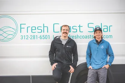 Fresh Coast Solar two men.standing in front of Fresh Coast Solar van