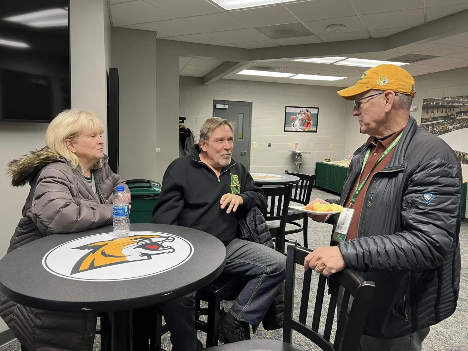 NMU Athletic Director Rick Comley hosted retirees at the Wildcats basketball games against Ferris State
